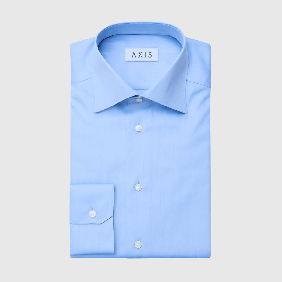 Light blue dress shirt with 'Axis' branding on a light gray background